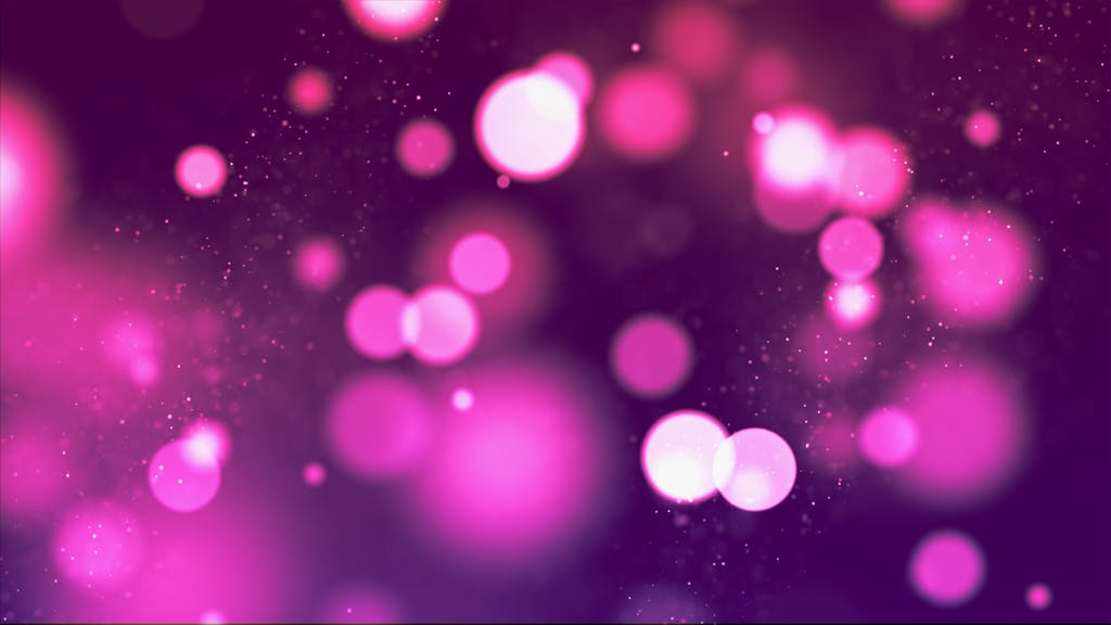 A mesmerizing pink bokeh light background perfect for creative designs and themes.